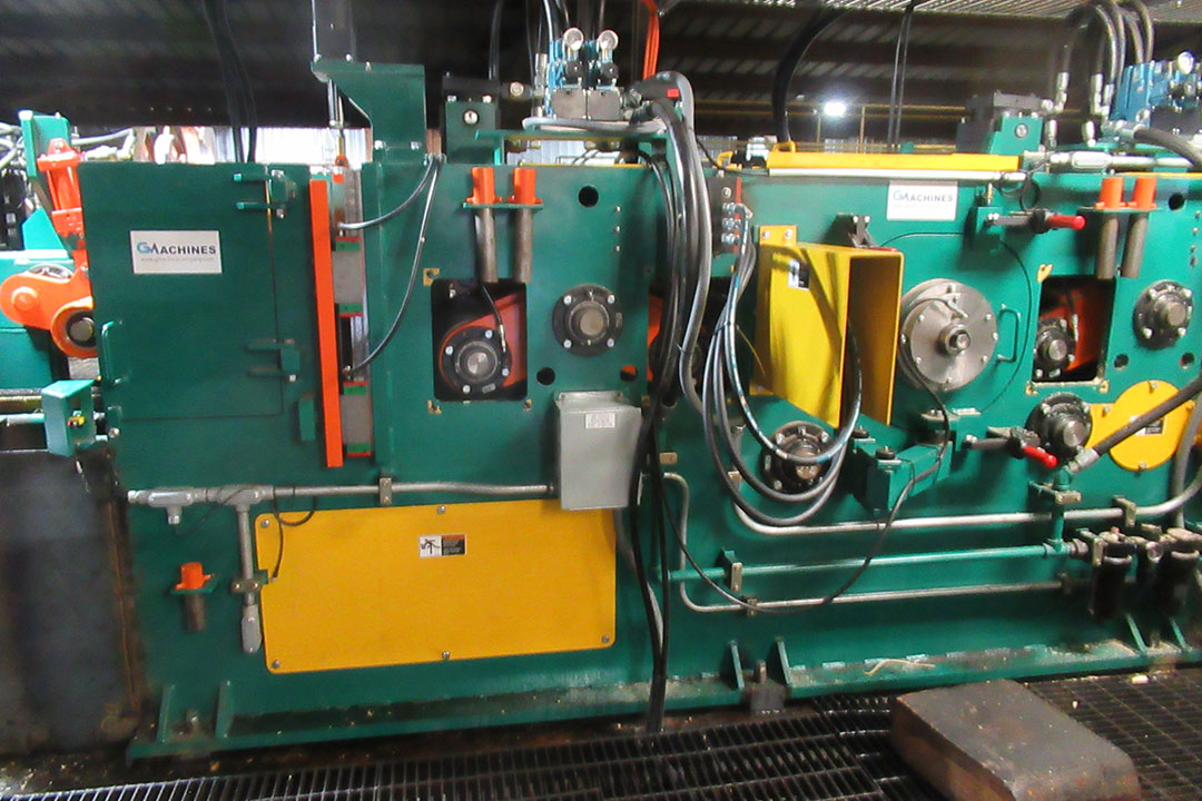 G Machine Company transverse board edger system with reducer head onsite at Chips, Inc. sawmill.